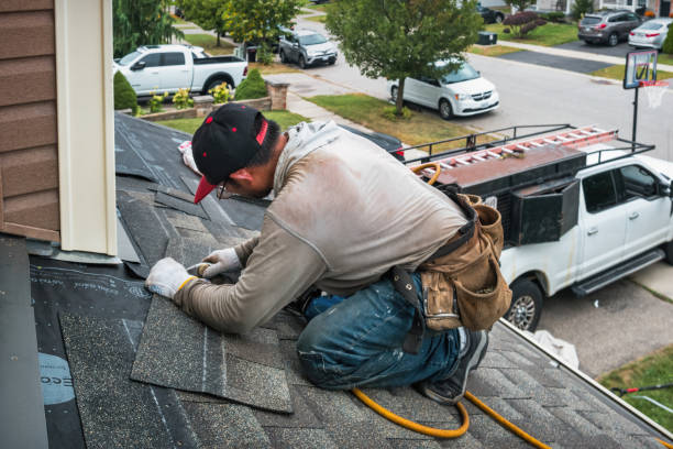 Professional Roofing technician working in Selden, NY